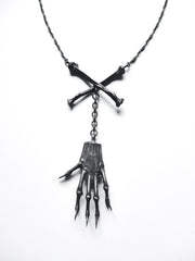 Witches Brew necklace with squirrel claw and crossbones
